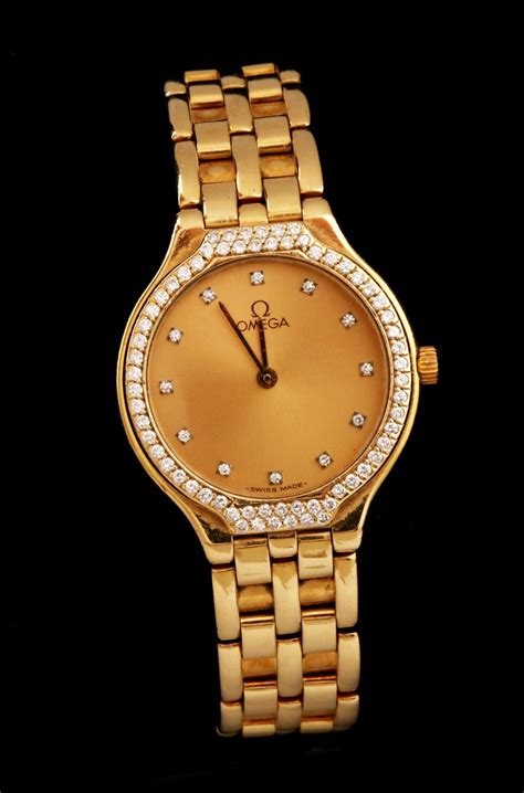 18k gold omega ladies watch.